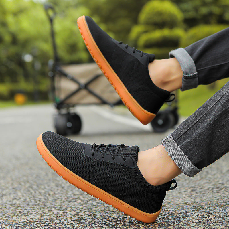 Black Mens barefoot shoes worn by a model