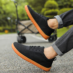 Black Mens barefoot shoes worn by a model