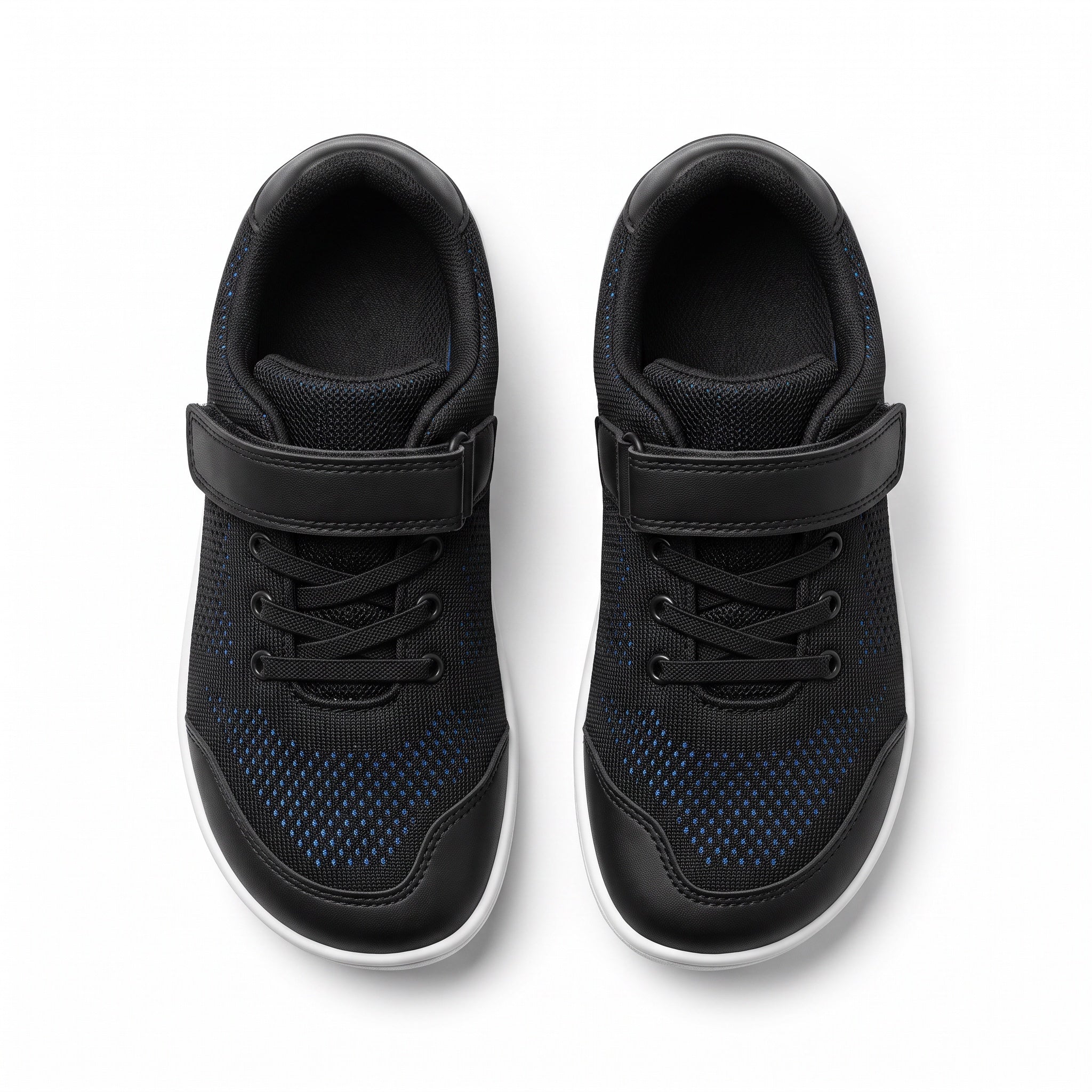 A pair of black children's barefoot shoes  with hook and loop strap closures, black laces, and a subtle dark blue dotted pattern on the side panels, shown from a top down view.