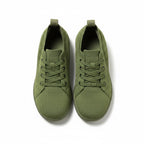 A pair of green low-top lace up sneakers shown from a top down view. 