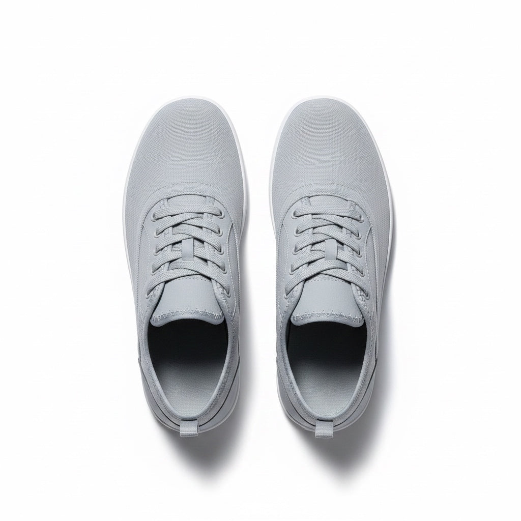 A pair of grey low top lace up Barefoot Shoes shown from a top down view.