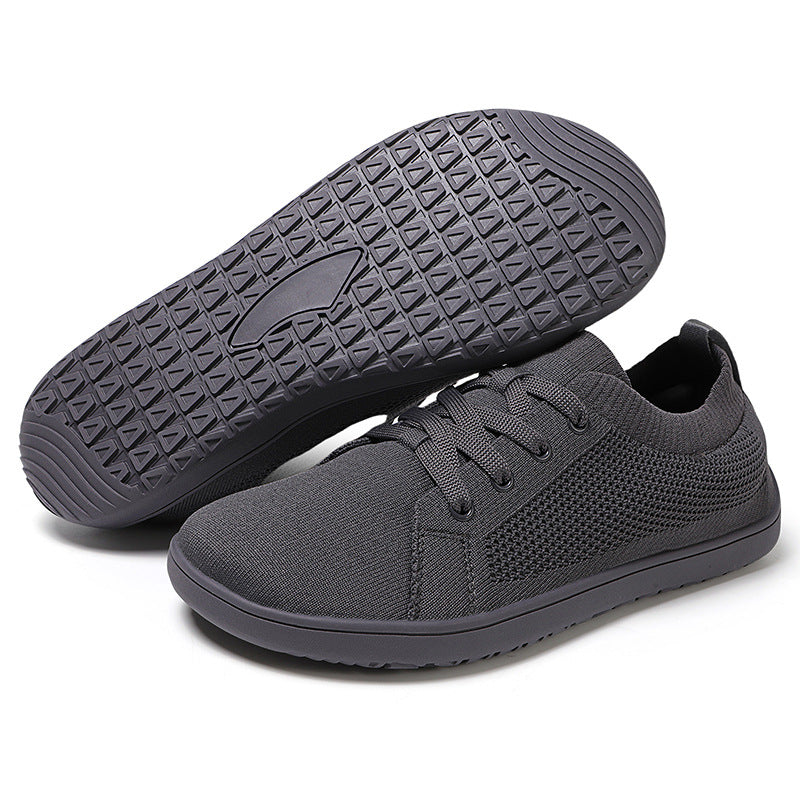 Grey sneakers with textured sole.