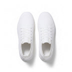 A pair of white low top lace up sneakers shown from a top down view. 