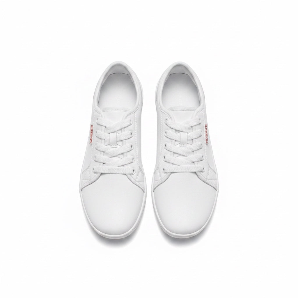 A pair of white leather low top Barefoot Shoes shown from a top down view.