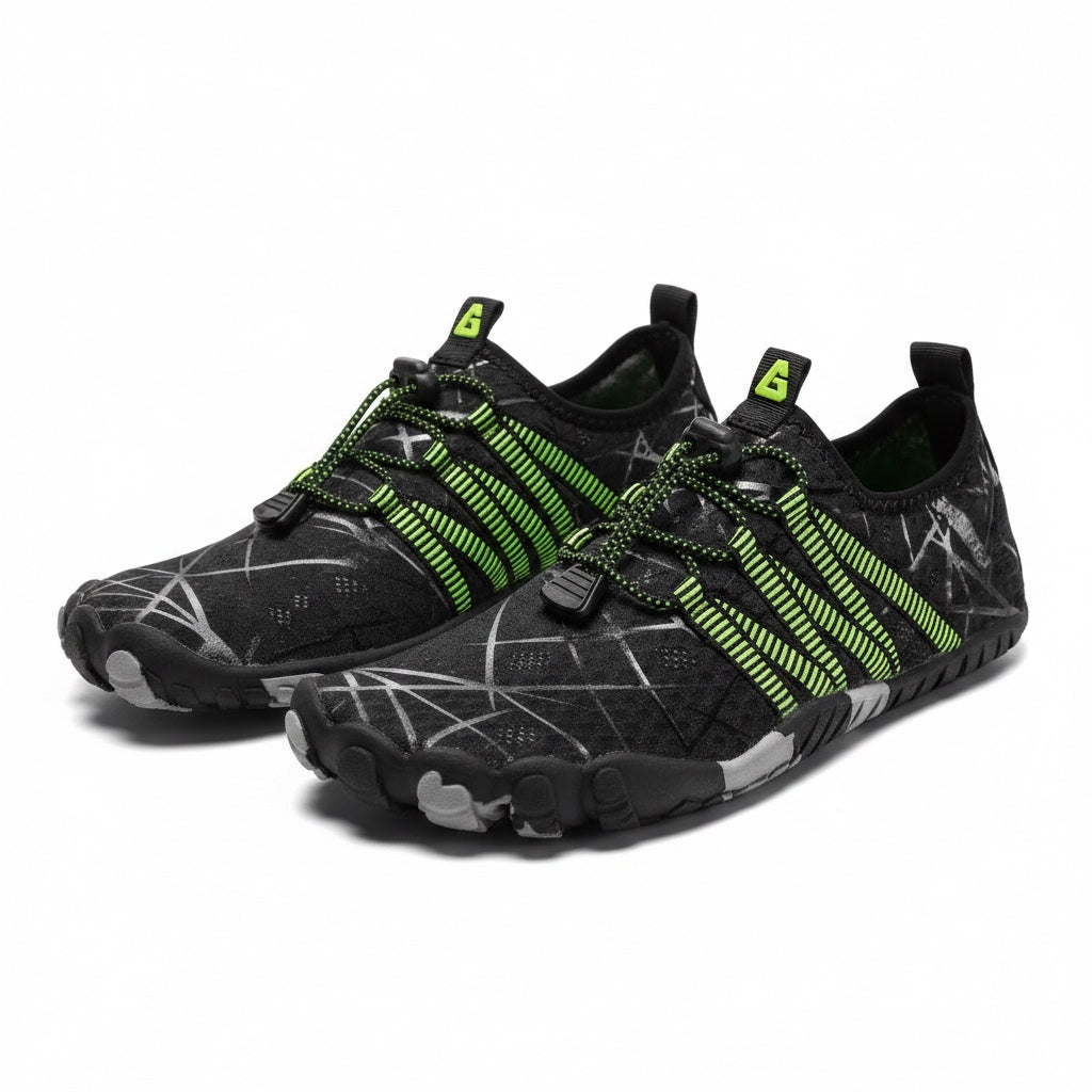 A pair of minimalist water shoes in black with bright neon green accents and grey scratch-like line patterns.