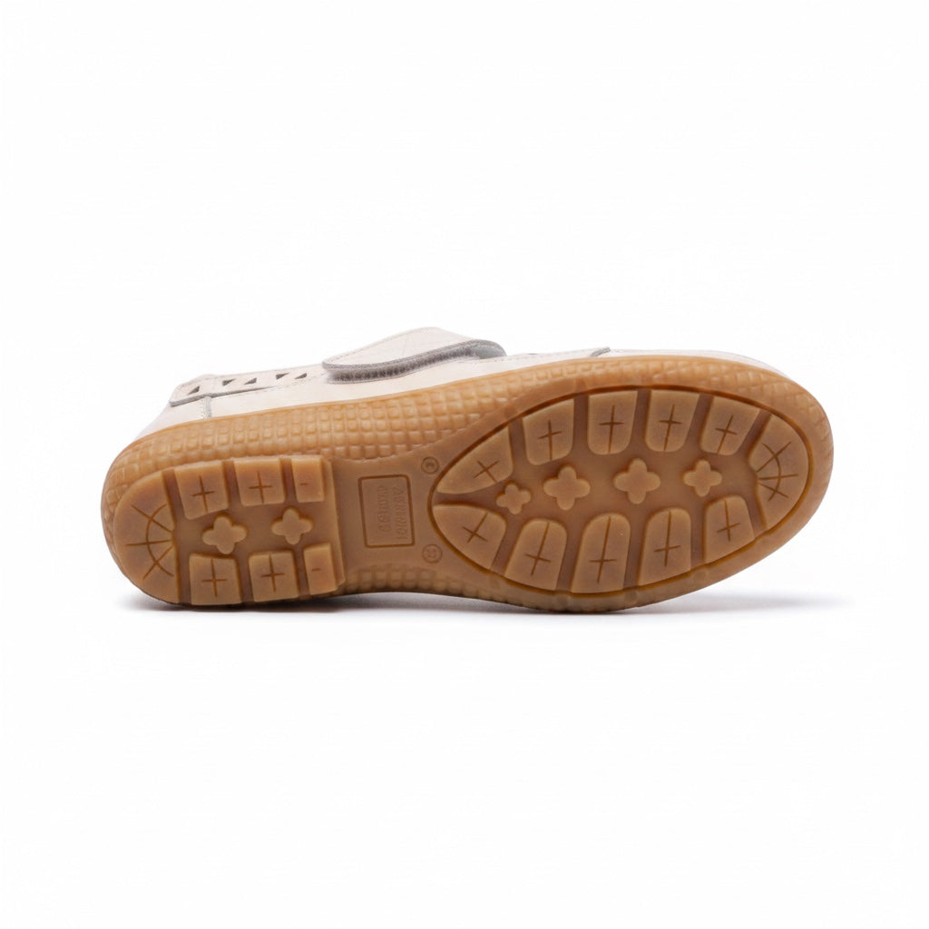 Bottom view of a Beige  comfort sandal with a textured brown rubber outsole