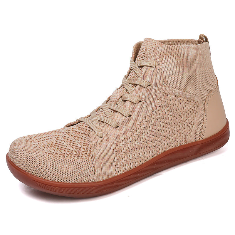 Beige high top sneaker with brown soles.