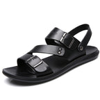 Black adjustable barefoot sandal showing minimalist design and flexible sole