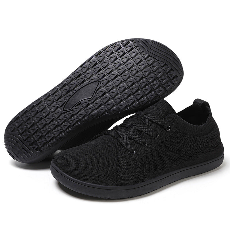 Black sneakers with a focus on sole texture.