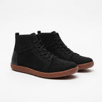A pair of black high top sneakers with a breathable mesh upper, black laces, and a brown gum soles.