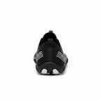 Rear view showing the heel structure and minimalist construction.