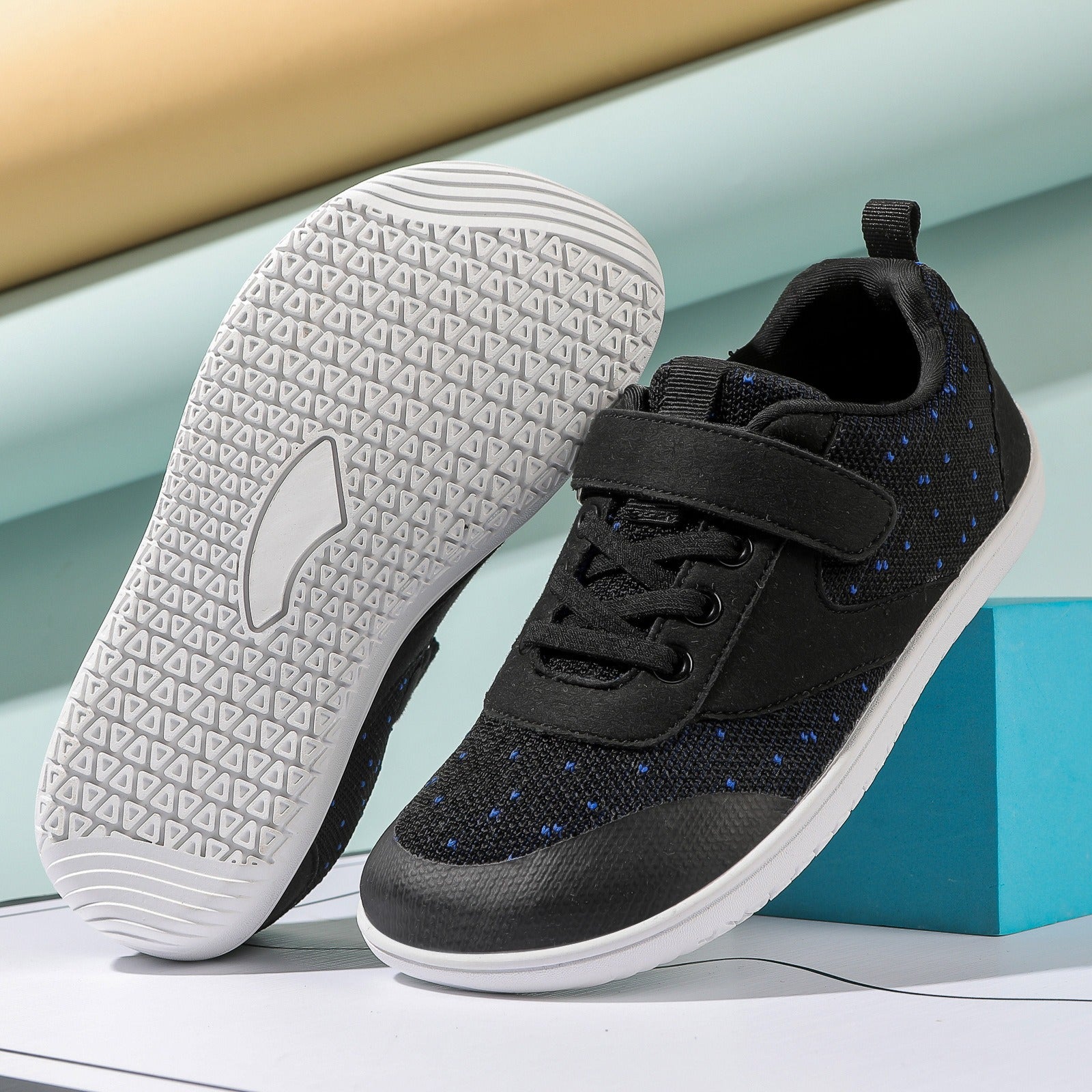 Black children's Barefoot Shoes with a white sole 