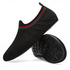 Pair of black barefoot water shoes with flexible non-slip soles
