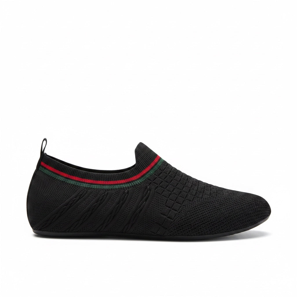 Bottom view of black barefoot water shoe with textured sole