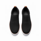 A pair of black slip On Loafers Shoes with white soles and tan pull tabs, shown from a top-down view.
