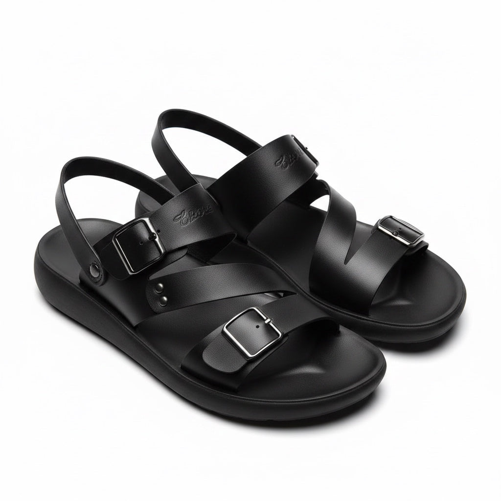 Pair of black minimalist barefoot sandals shown from an angled view
