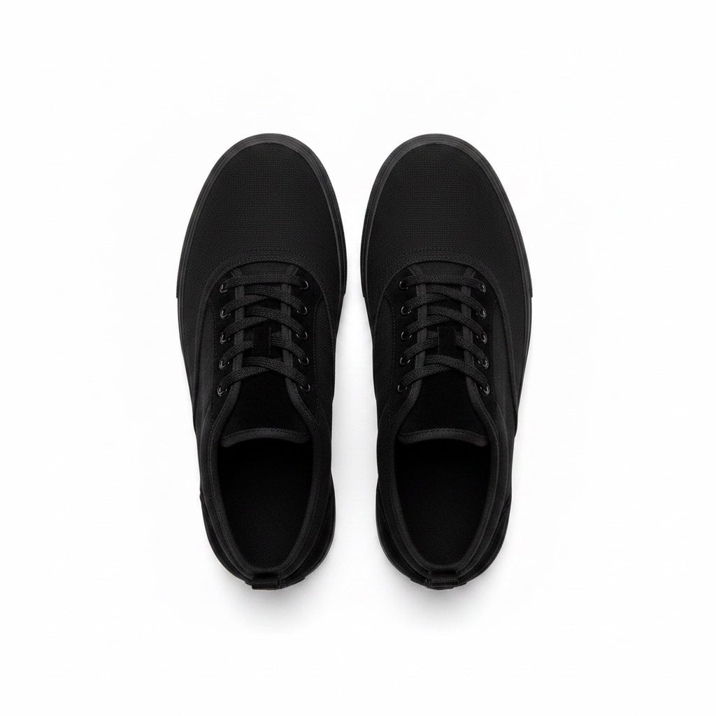 A pair of black low top lace up Barefoot shoes shown from a top down view.