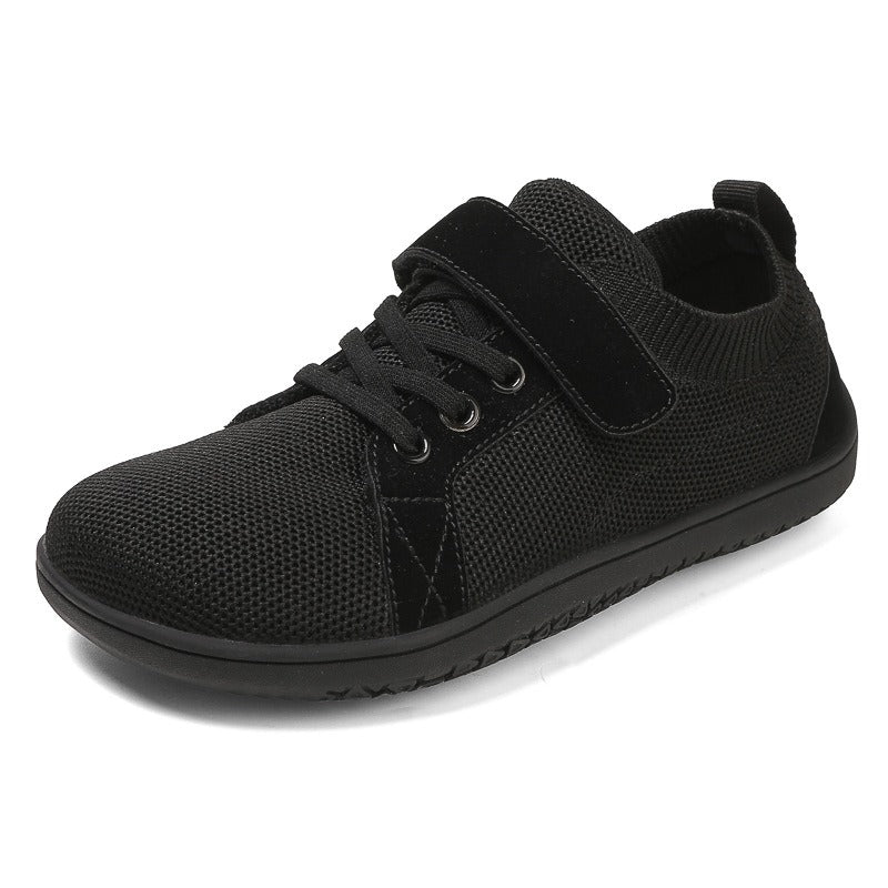 Black Barefoot children's shoes with velcro strap on.