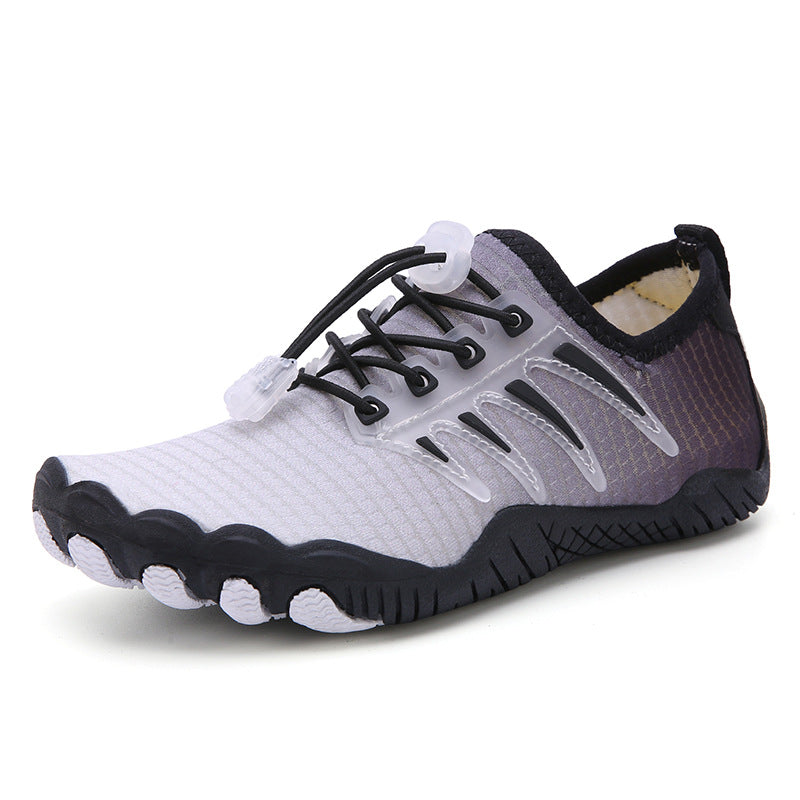 Black and grey barefoot water shoe shown from an angled side view