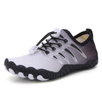 Black and grey barefoot water shoe shown from an angled side view
