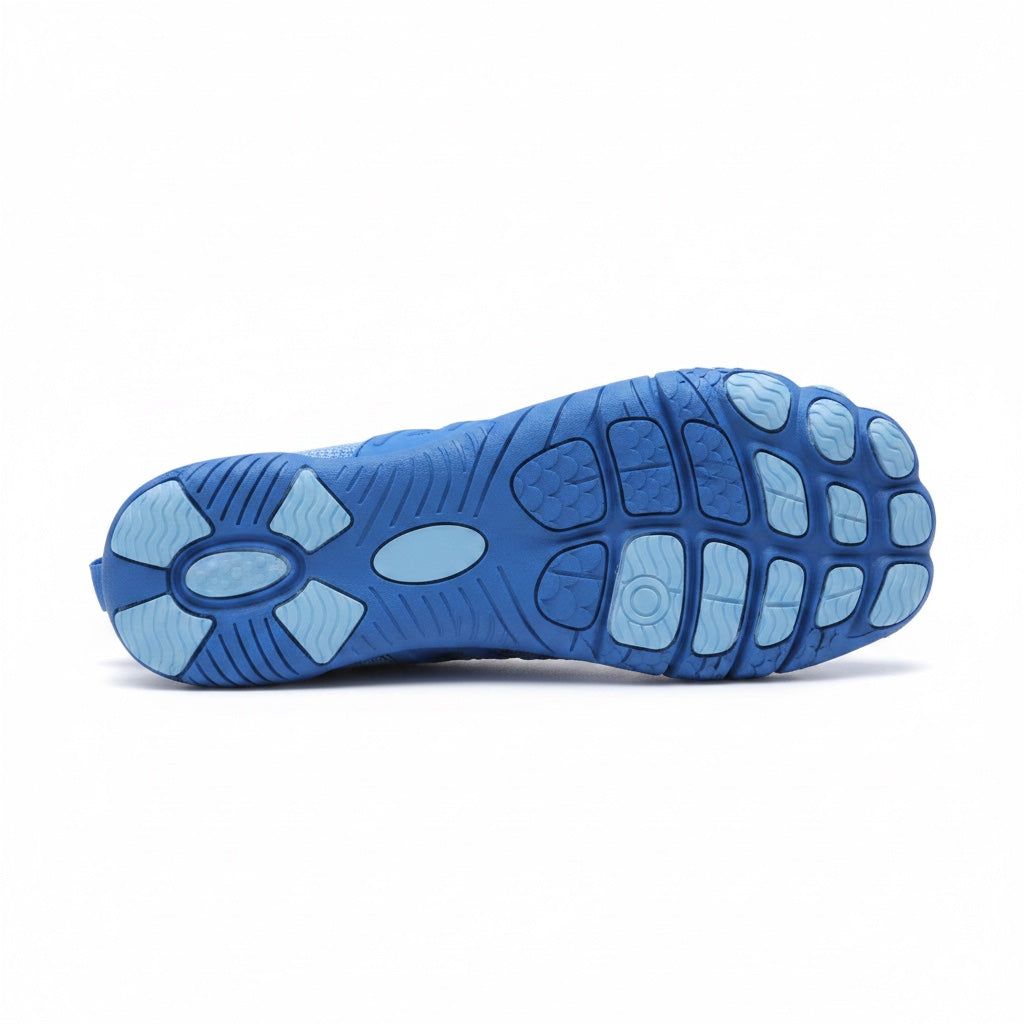 Bottom view of a blue barefoot shoe showing its textured rubber traction sole