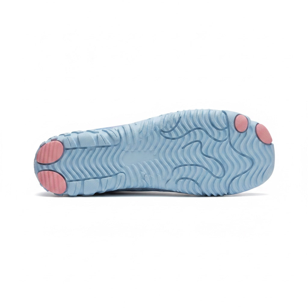 Bottom view showing the flexible textured sole with pink grip sections.