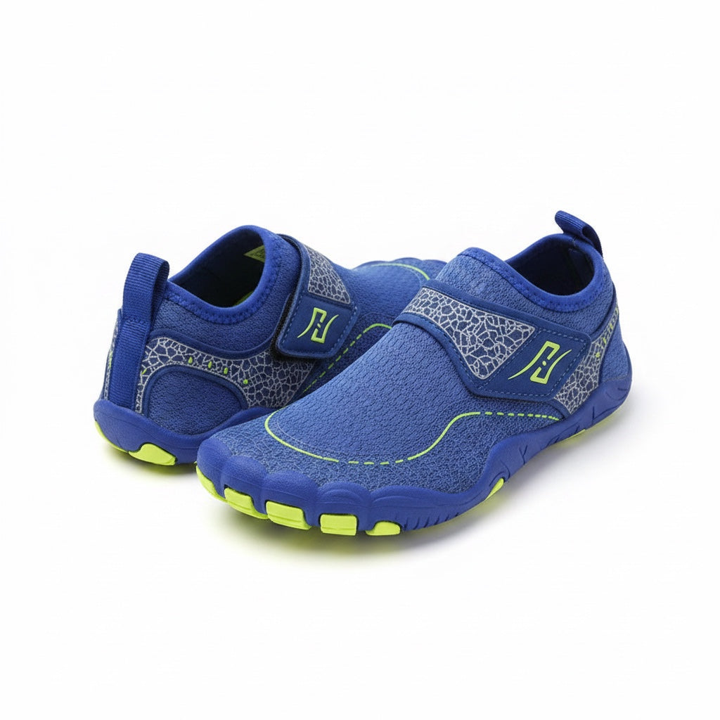 A pair of blue Children's water shoes with grey patterned straps and neon yellow accents.