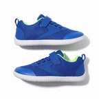 A pair of blue mesh children barefoot shoes with white soles, featuring bright neon green lining and hook and loop strap closures.