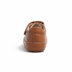 Rear view of a brown baby shoe showing its heel and flexible rubber sole