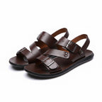 Pair of brown minimalist barefoot sandals with adjustable straps