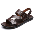 Brown barefoot sandal with straps and buckles. 
