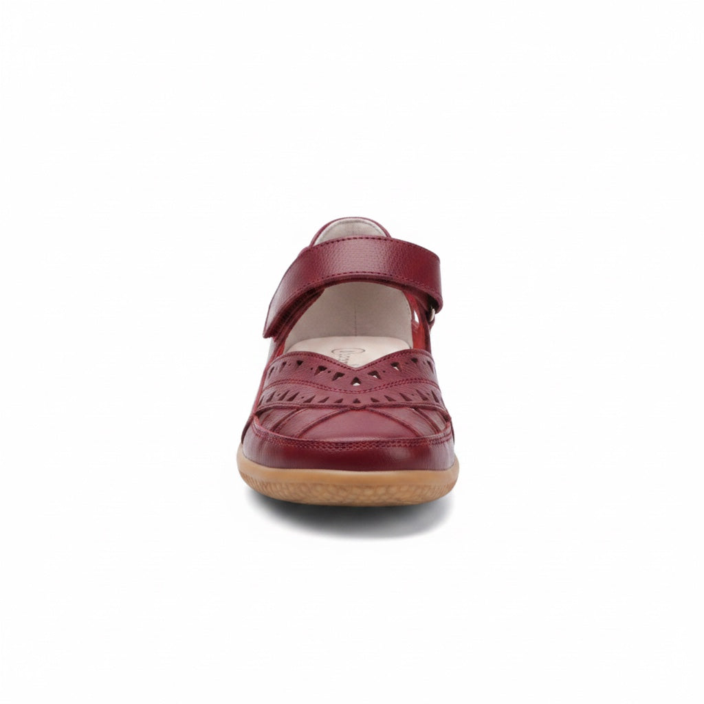 Front view of a burgundy women's comfort sandal with adjustable strap