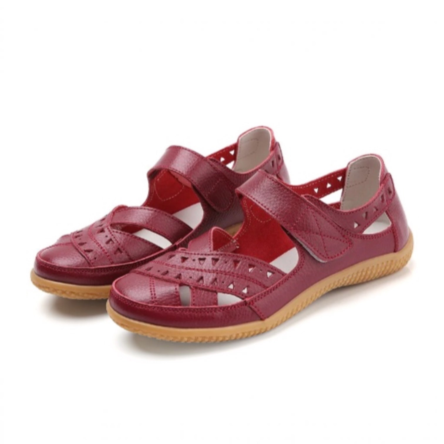 Pair of burgundy women's comfort sandals with adjustable straps and flexible soles