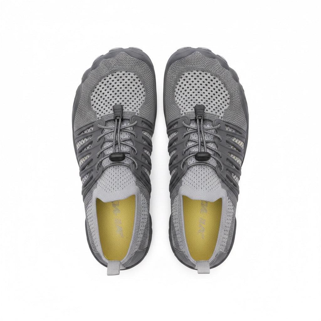 A pair of grey mesh athletic shoes shown from a top-down view.