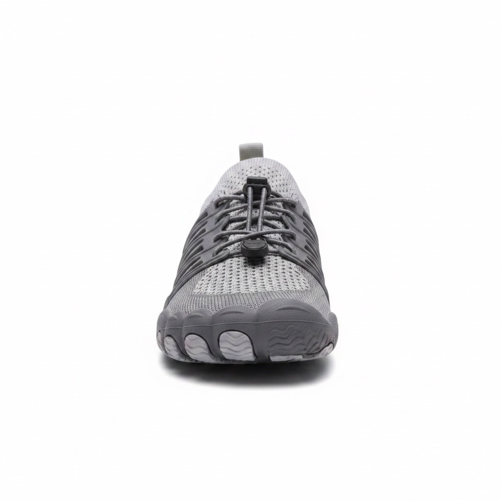 Front view of a grey unisex barefoot shoe with breathable upper and flexible sole