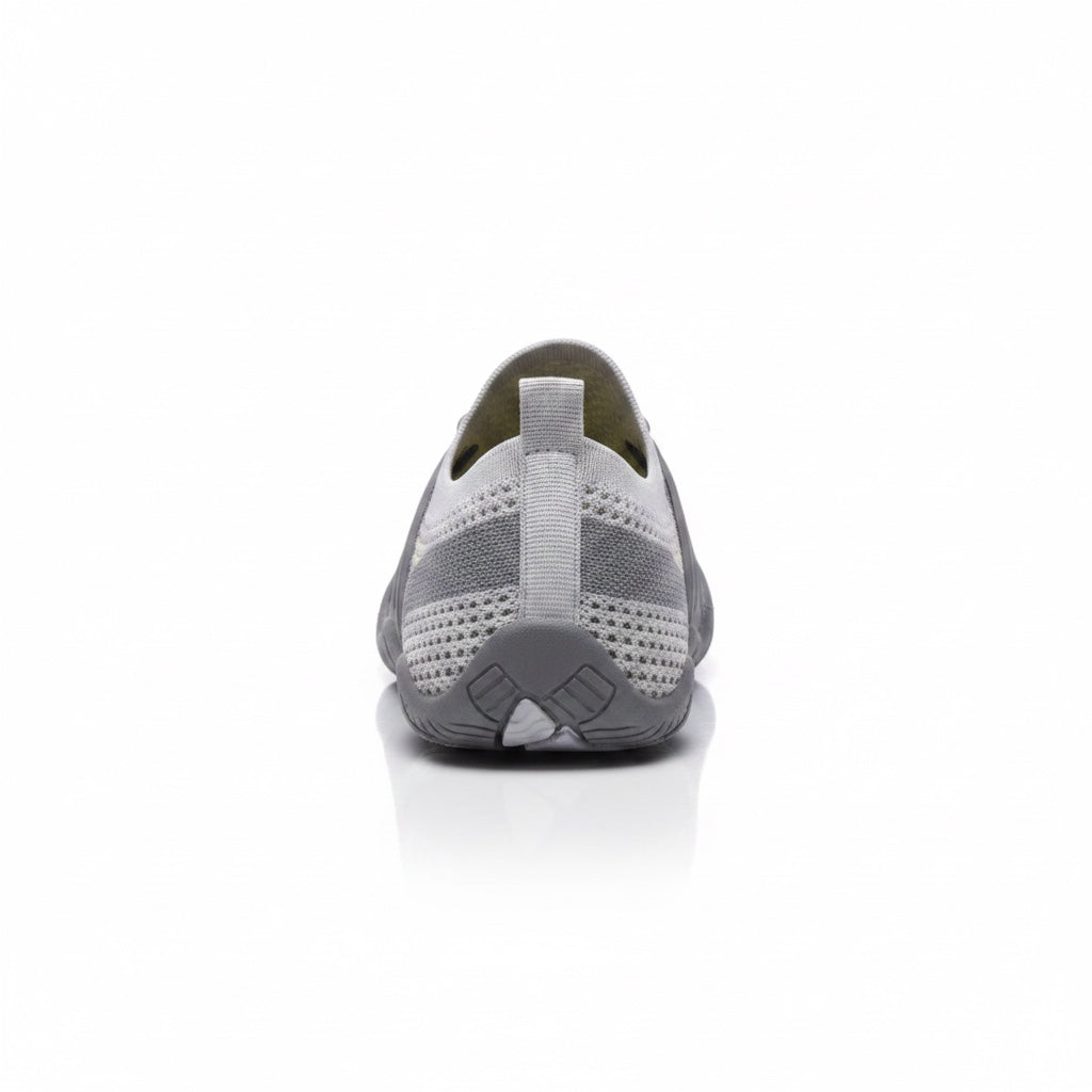 Rear view of a grey barefoot shoe showing the heel and flexible sole