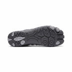 Bottom view of a grey barefoot shoe showing its textured rubber sole