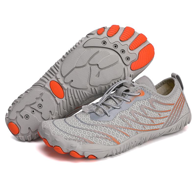Pair of grey barefoot shoes showing the lightweight construction and flexible outsole.