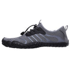 Grey unisex barefoot shoes from a side angle