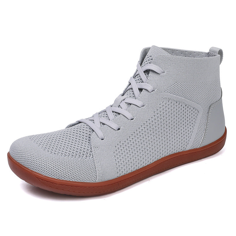Grey barefoot shoes with brown sole made with knit textile for high quality finish. Wide toe for natural foot movement and foot health.
