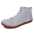 Grey barefoot shoes with brown sole made with knit textile for high quality finish. Wide toe for natural foot movement and foot health.