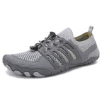 Pair of grey unisex barefoot shoes with lightweight breathable uppers and flexible soles