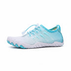 Light blue barefoot water shoe shown from the side with a lightweight flexible design
