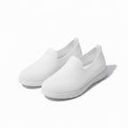 A pair of white slip on mesh loafers shoes with white soles.