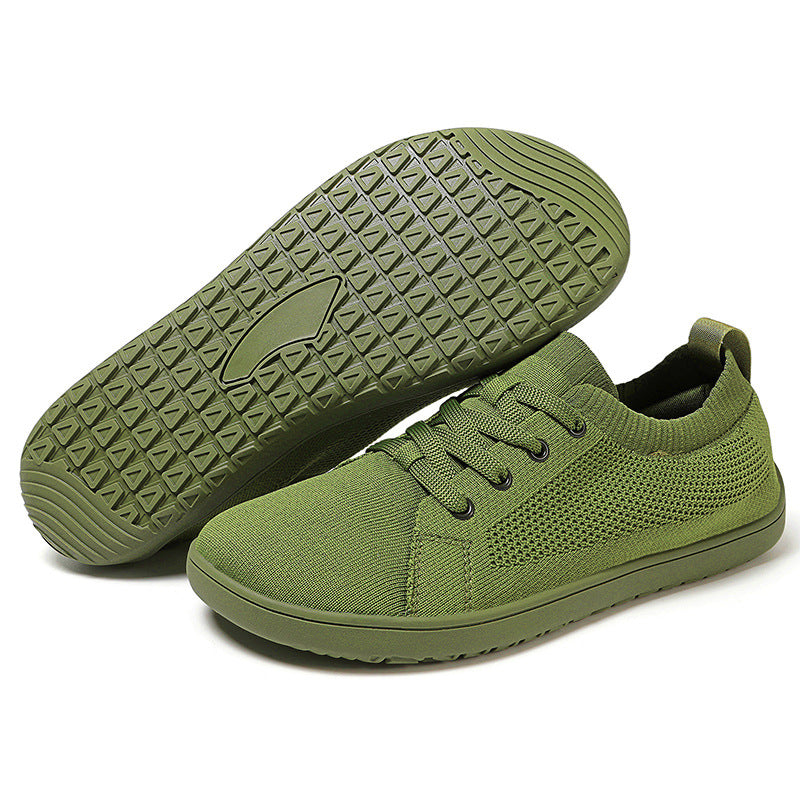 Green sneakers with textured sole. 
