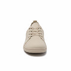 Front view of a beige men's knit barefoot shoe with matching laces and rounded toe.