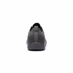Rear view of a black men's knit barefoot shoe showing the heel construction and knit upper.