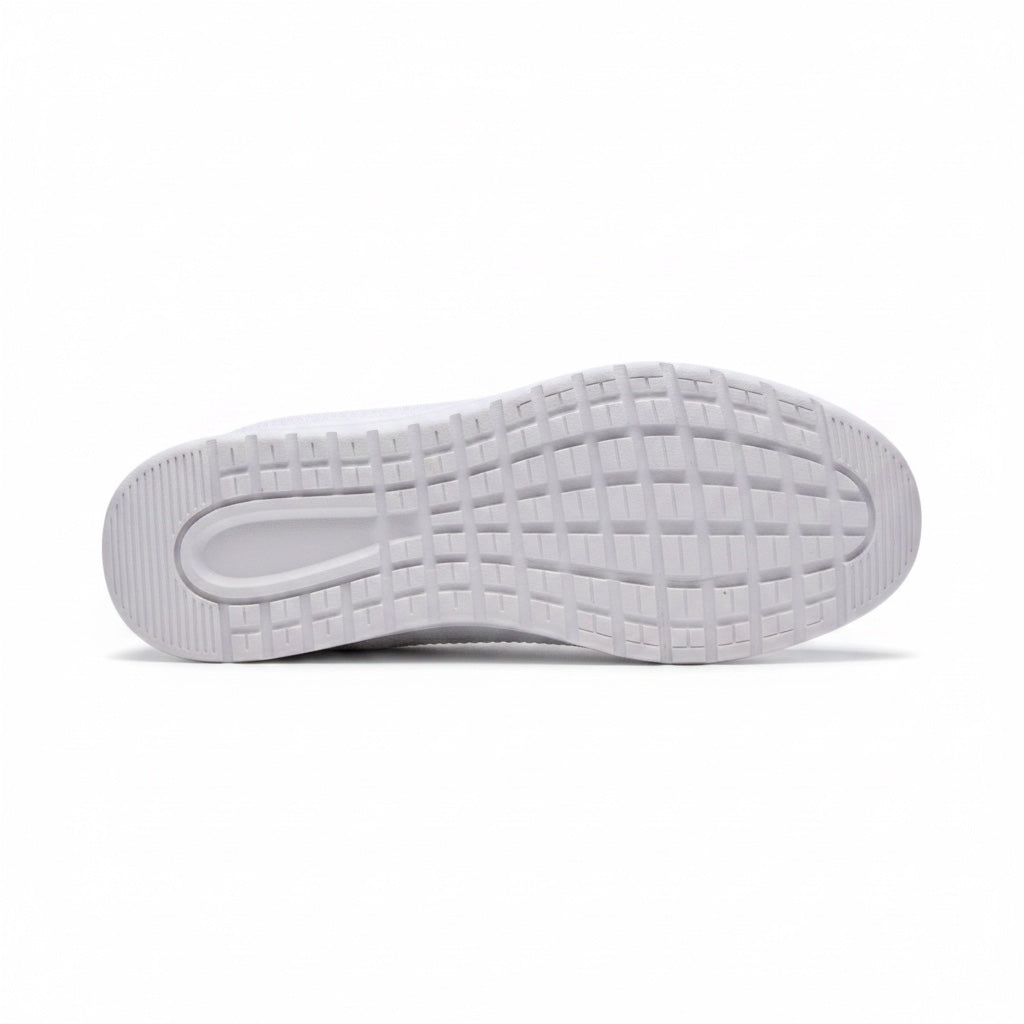 Bottom view of a white men's knit barefoot shoes showing the patterned rubber outsole.