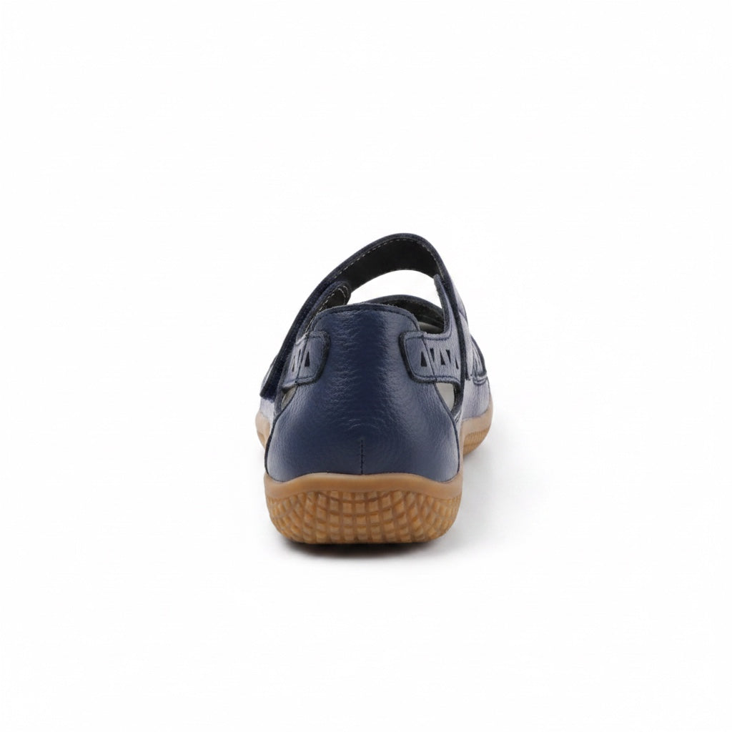 Rear view of a Navy Blue  comfort sandal with adjustable heel strap and brown sole