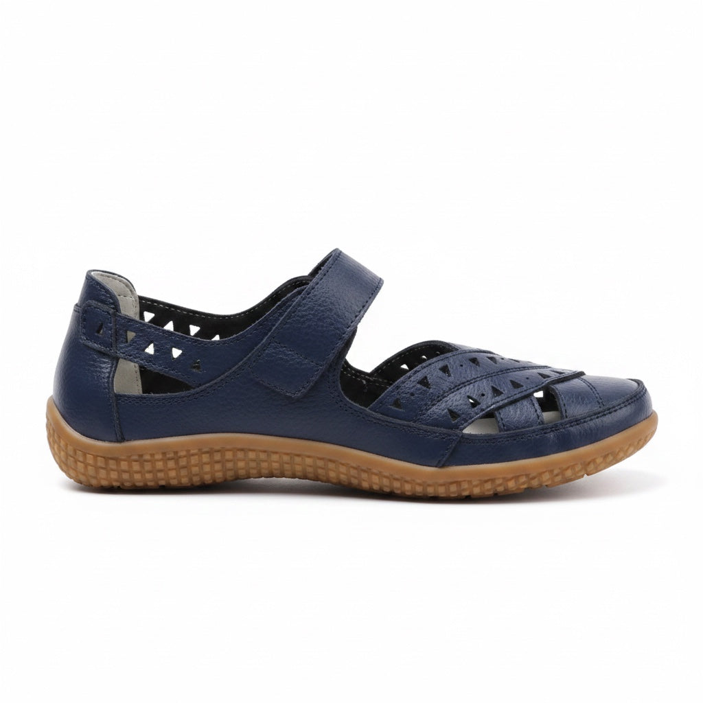 Blue women's comfort sandal with adjustable straps, perforated upper, and brown sole